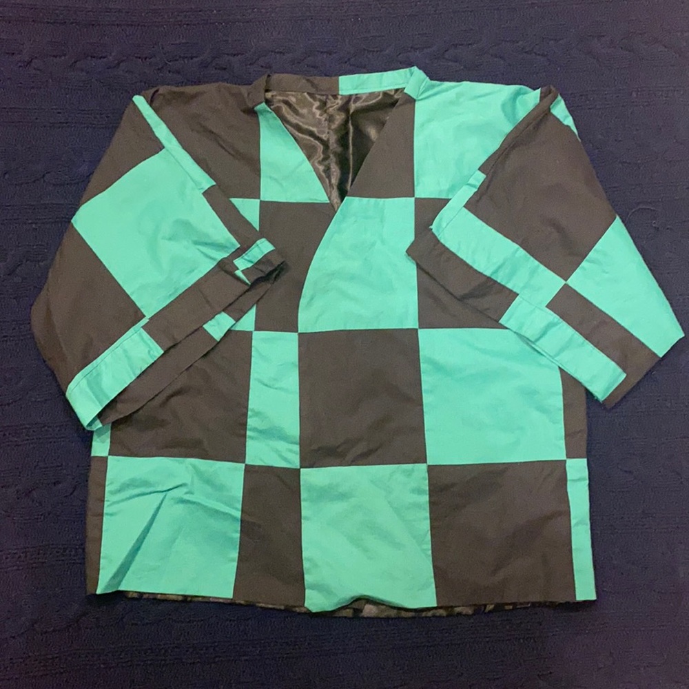 Custom made half-sleeve demon slayer style jacket. Very light and loose fitting.